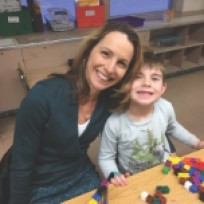 Adrianna Kwapien shares a moment with her son, Caleb, during ÒCrazy 8s Math ClubÓ at Crocker Elementary School on Thursday evening.