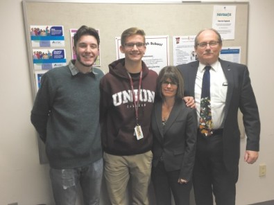 Fitchburg High senior Landon Tucker, who recently was selected as a Boston Posse Scholar and will be attending Union College, is joined by his friend, Sage Bray, and his parents, Karen and Randy. COURTESY PHOTO